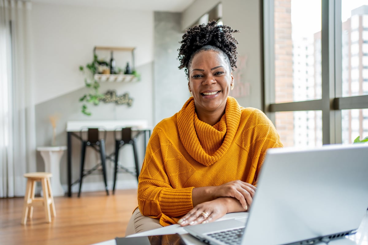 Portrait of a Black woman working at her home office