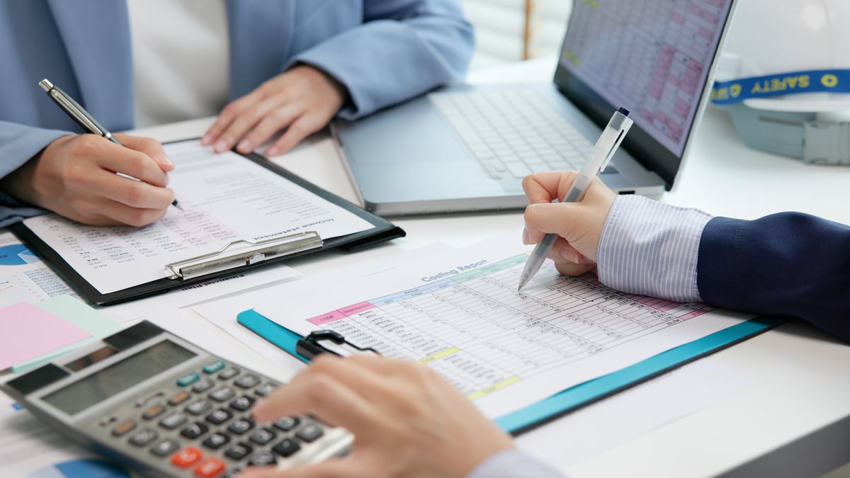 Tax professional reviewing financial data and planning documents